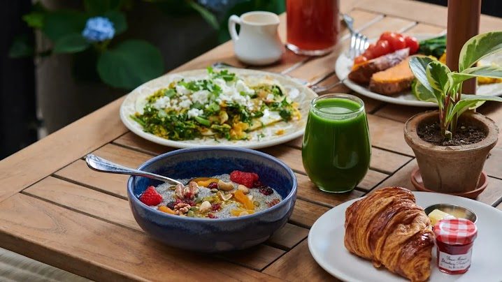 Breakfast on the terrace, with a cold-pressed green juice