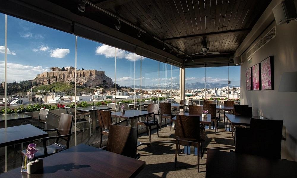 The rooftop restaurant at The Athens Gate Hotel by day, overlooking the Acropolis