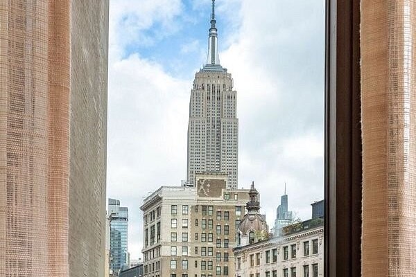 The Empire State Building, seen from a window at Broadway Plaza Hotel