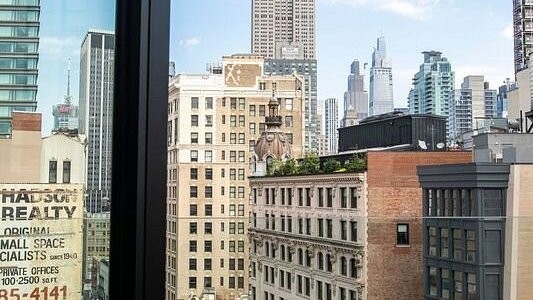 The Manhattan skyline, seen from a window at Broadway Plaza Hotel