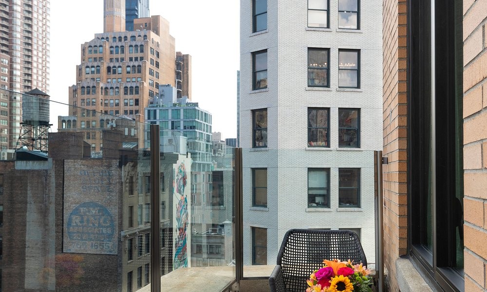 A rooftop terrace at Broadway Plaza Hotel, looking out over Manhattan rooftops