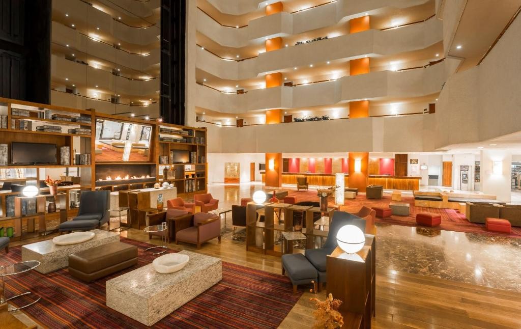 The soaring atrium lobby at Camino Real Aeropuerto