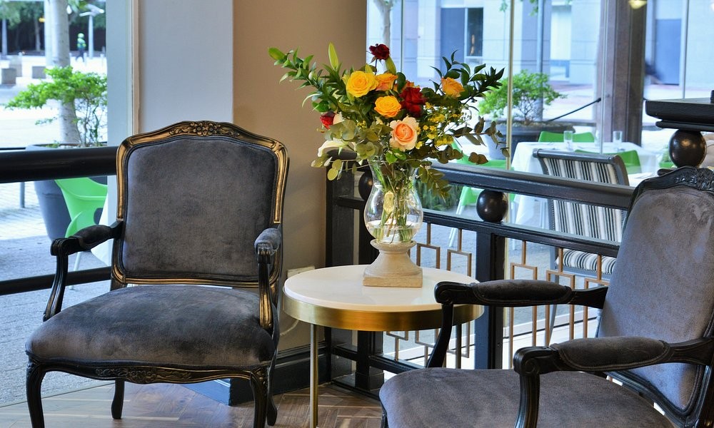 An outdoor terrace at The Capetonian, set with flowers