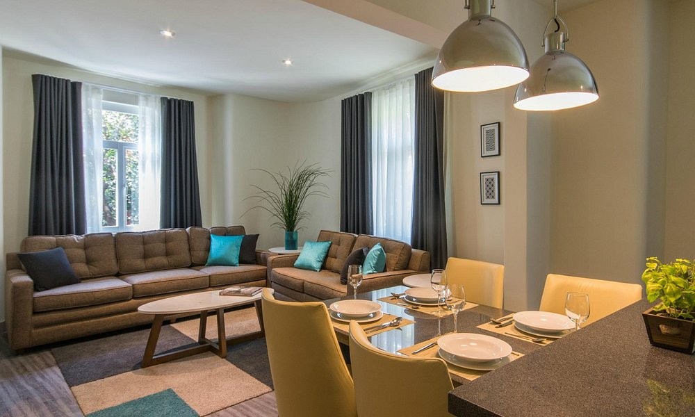 A residence-style suite at Casa Malí by Dominion, with its own living and dining area