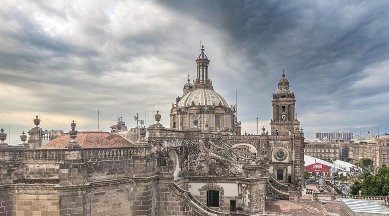 The Metropolitan Cathedral's dome under stormy skies, seen from a rooftop near Hotel Catedral