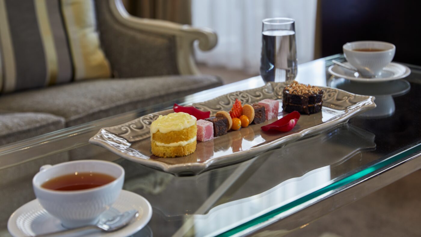 An afternoon tea spread of petits fours and tea