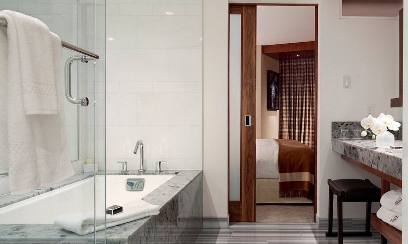 A marble bathroom with a soaking tub
