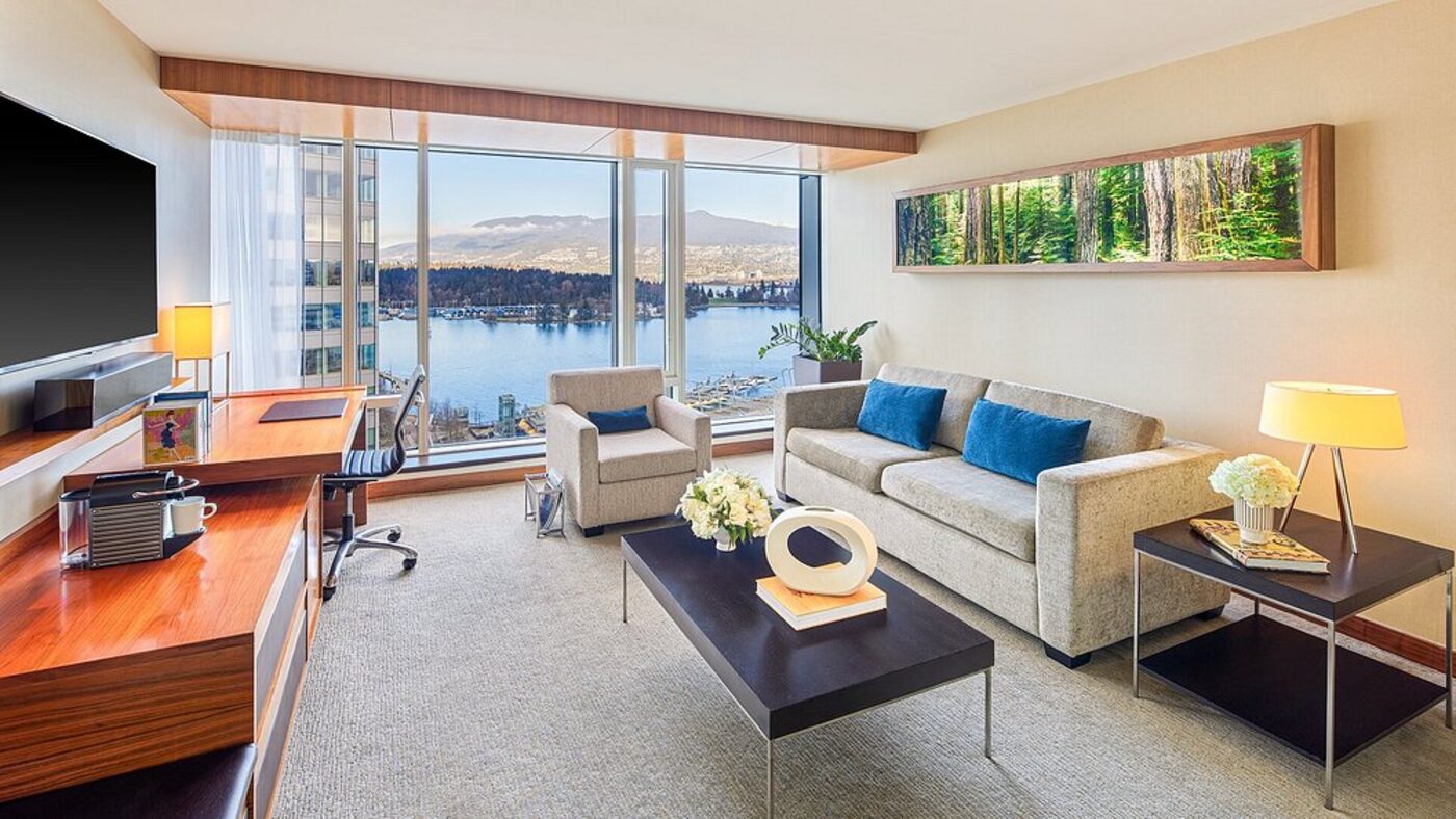 A suite living room with mountain and harbour views