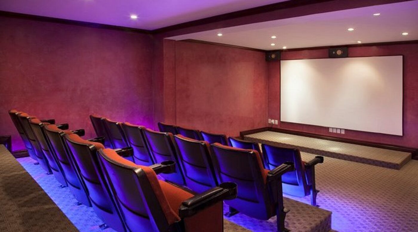 The hotel's private screening room, with rows of theatre seating