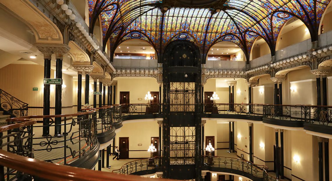 The grand atrium and its tiers of ironwork balconies
