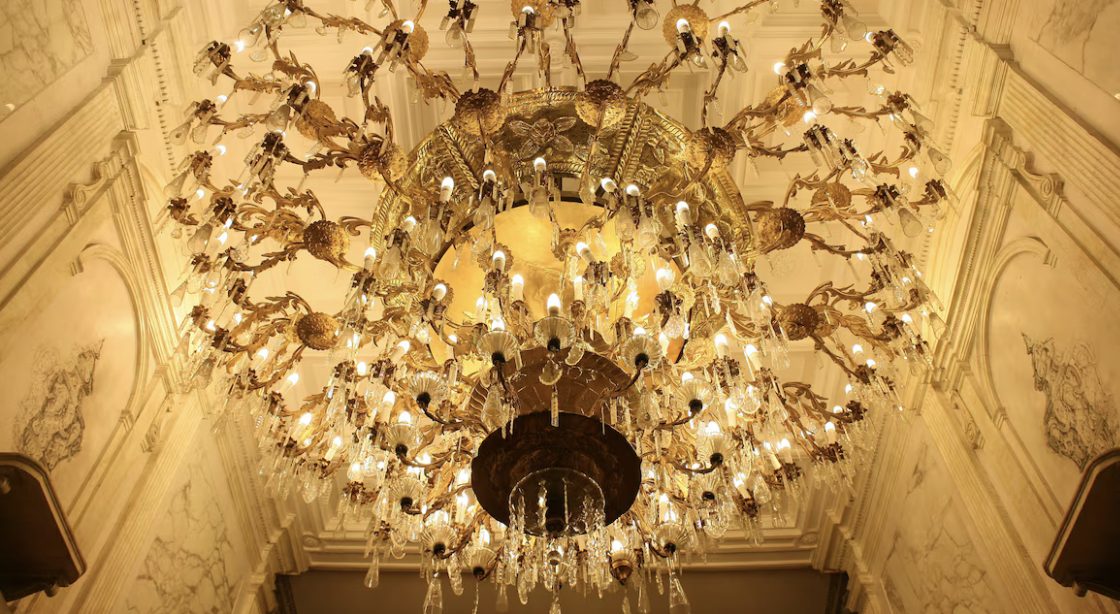 One of the hotel's opulent gilded chandeliers