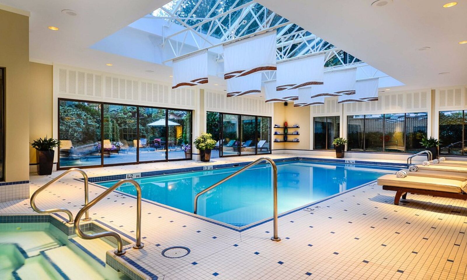The indoor pool beneath a skylight at The Sutton Place Hotel