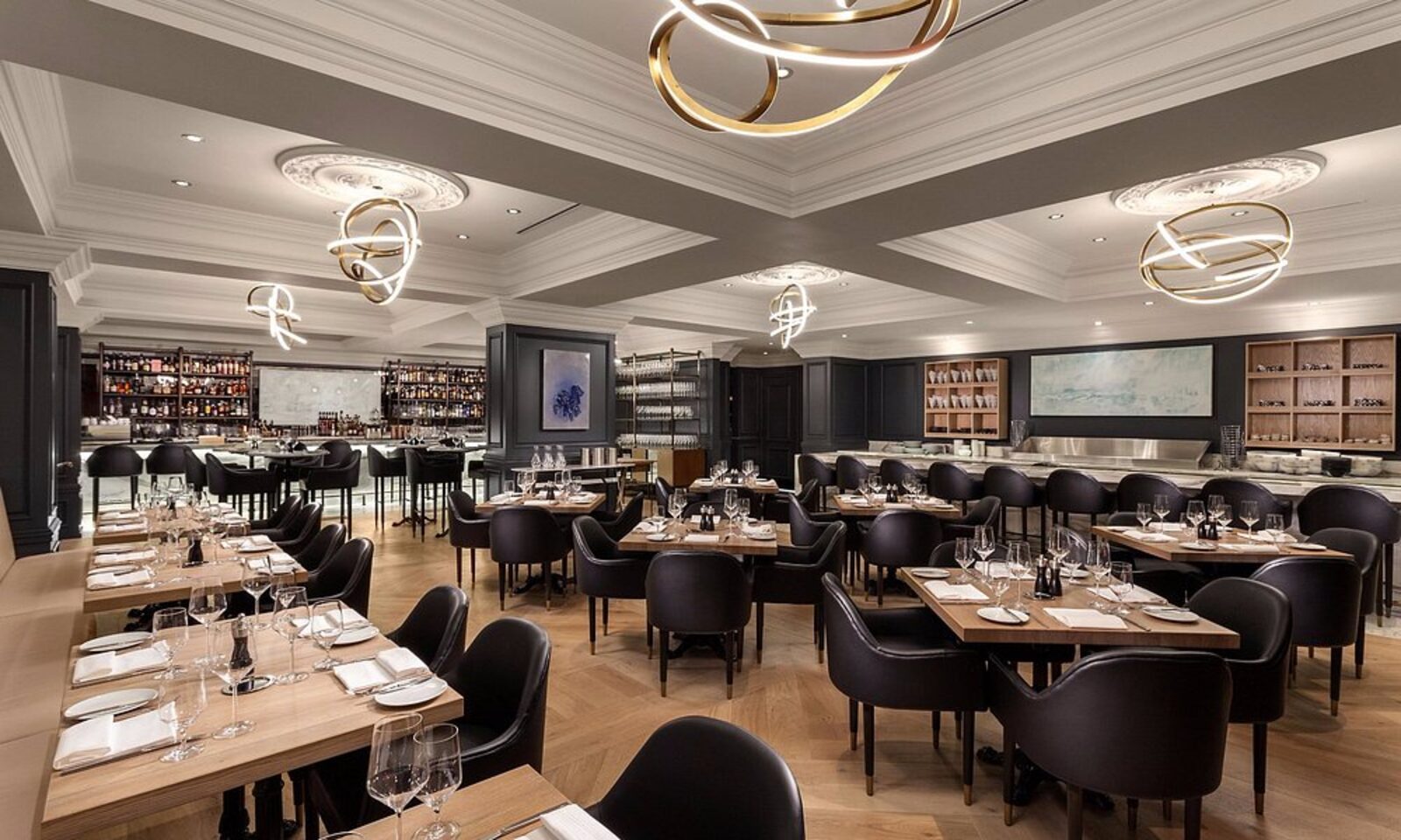 The Sutton Place Hotel's restaurant, with sculptural gold pendant lighting