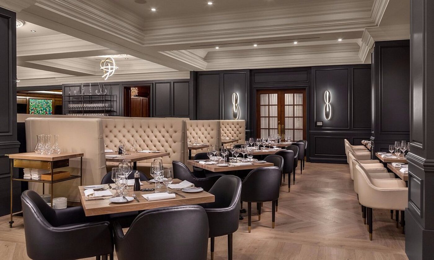 A second view of the hotel restaurant, with tufted banquettes