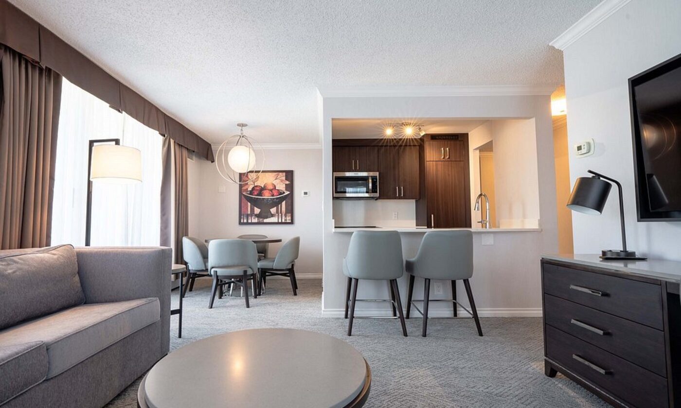 A suite living room with an open kitchen bar