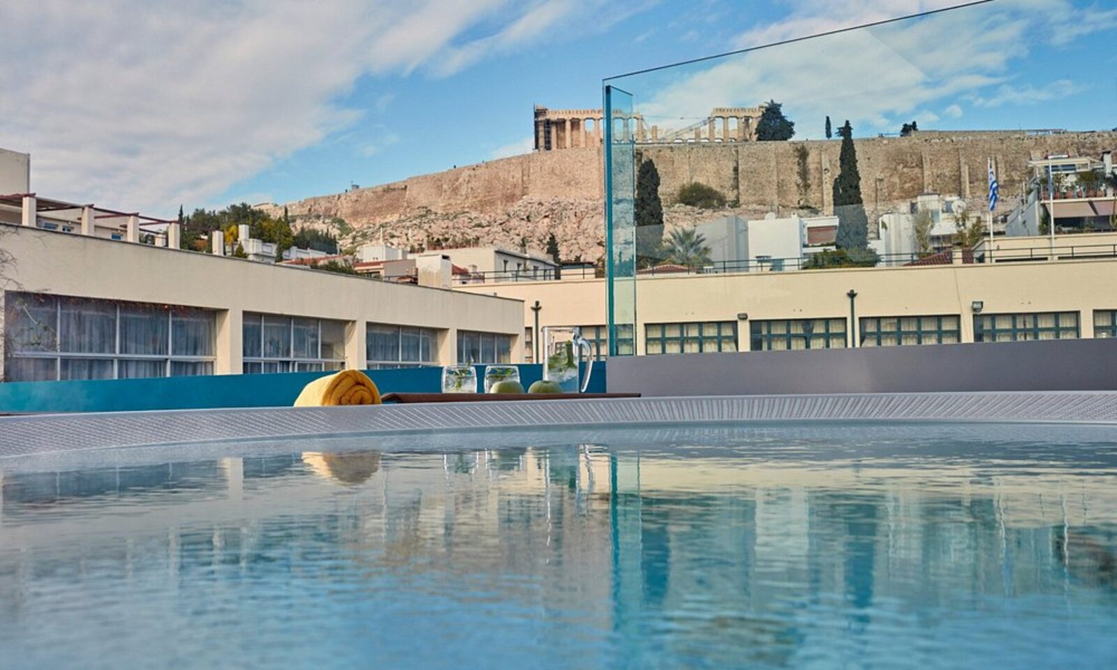 The rooftop pool by day, with the Acropolis and Parthenon in view