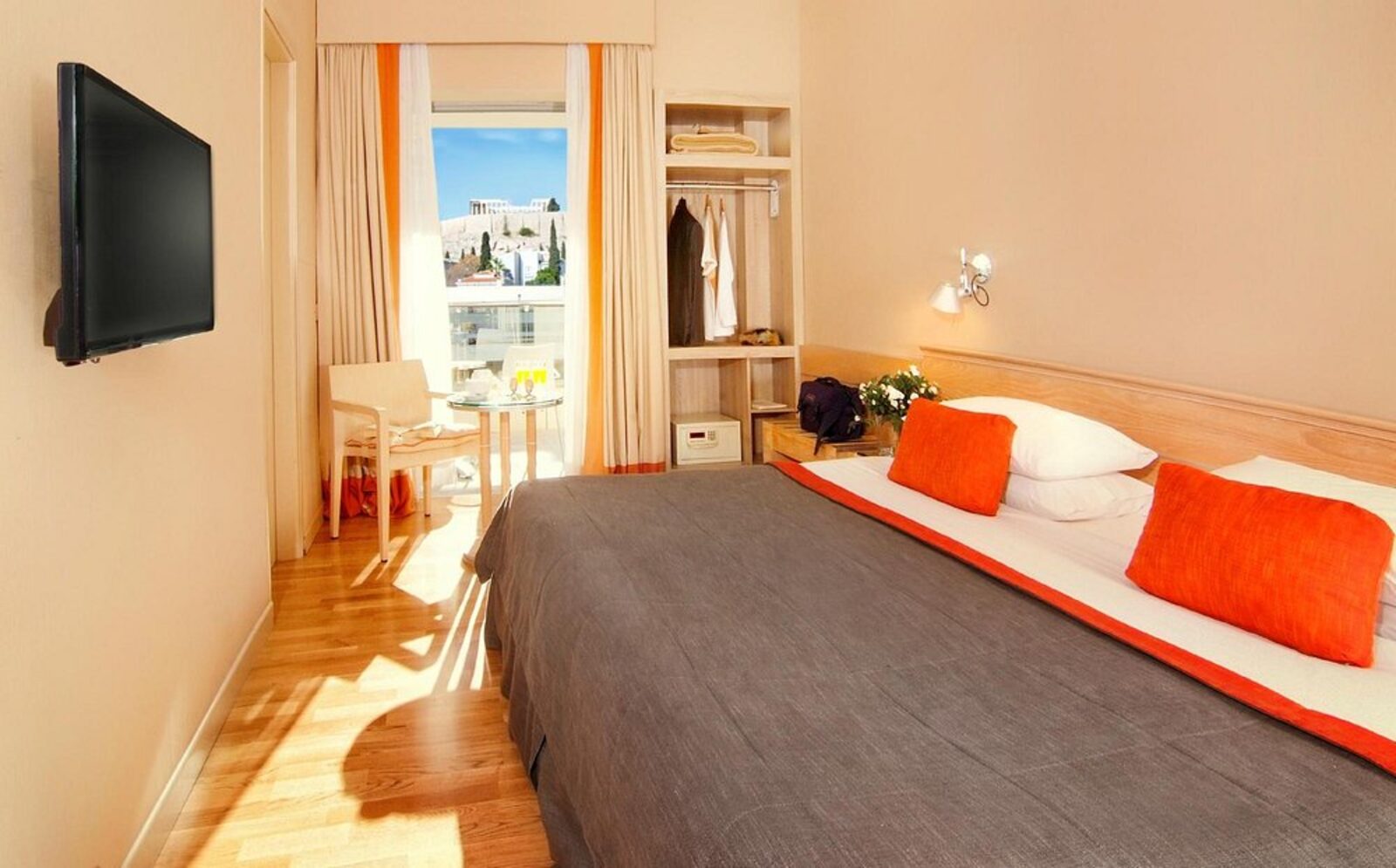 A room at the Herodion with a balcony framing the Acropolis