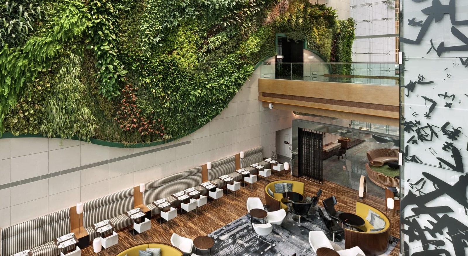 The soaring green wall above the atrium restaurant