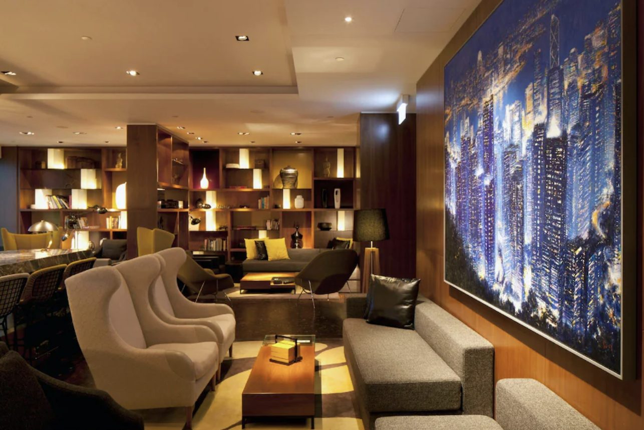 The club lounge, hung with a luminous skyline artwork