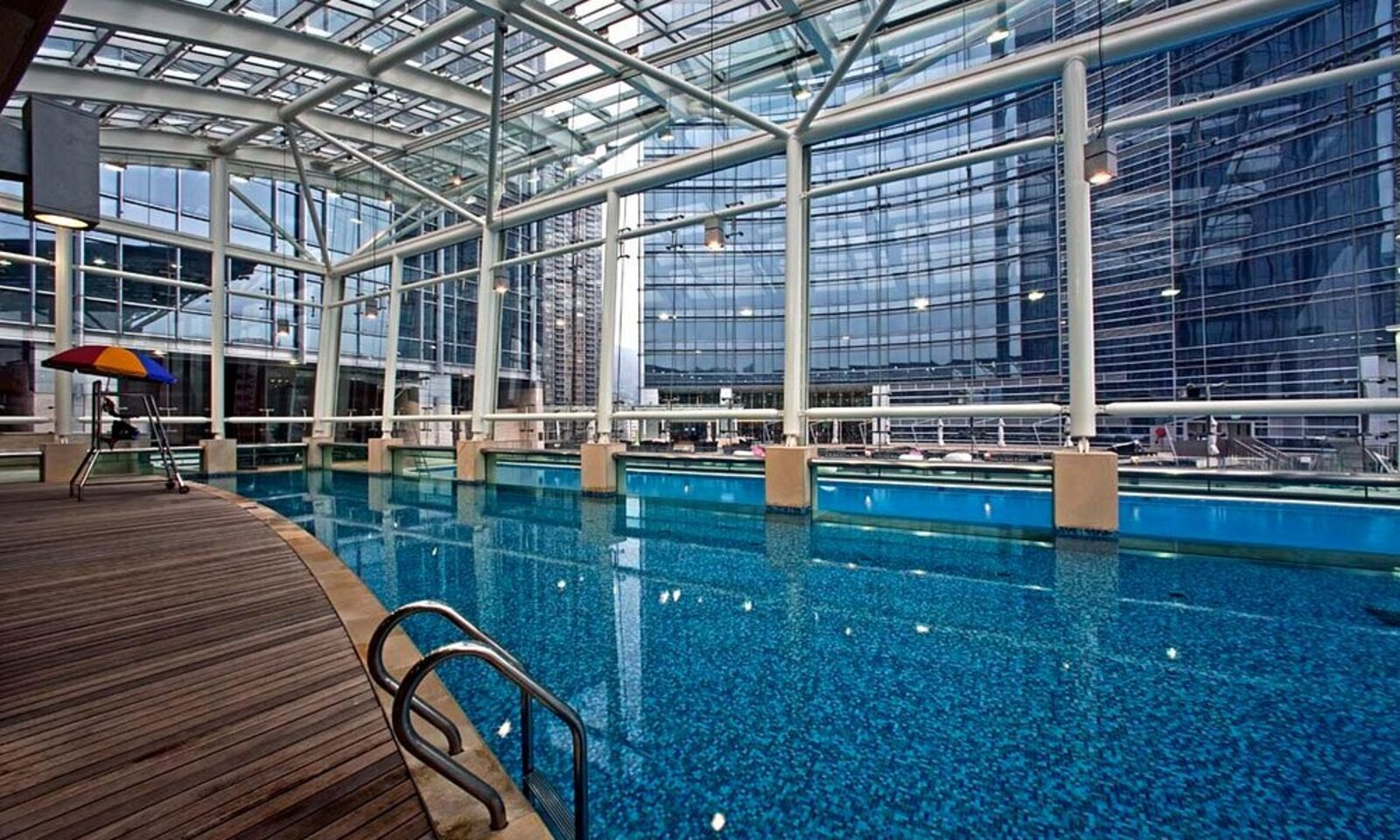 The glass-roofed indoor pool at Nina Hotel Tsuen Wan West