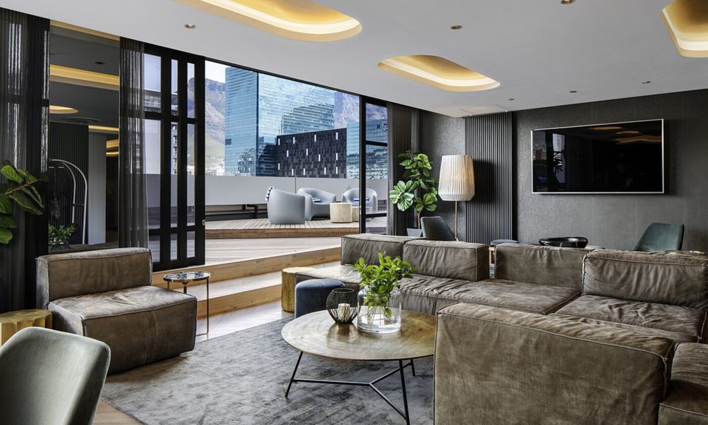A lounge deck with mountain and city views
