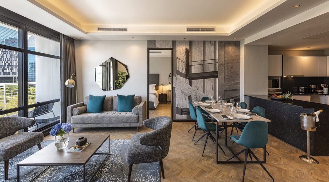 A suite living and dining area at The Onyx Hotel