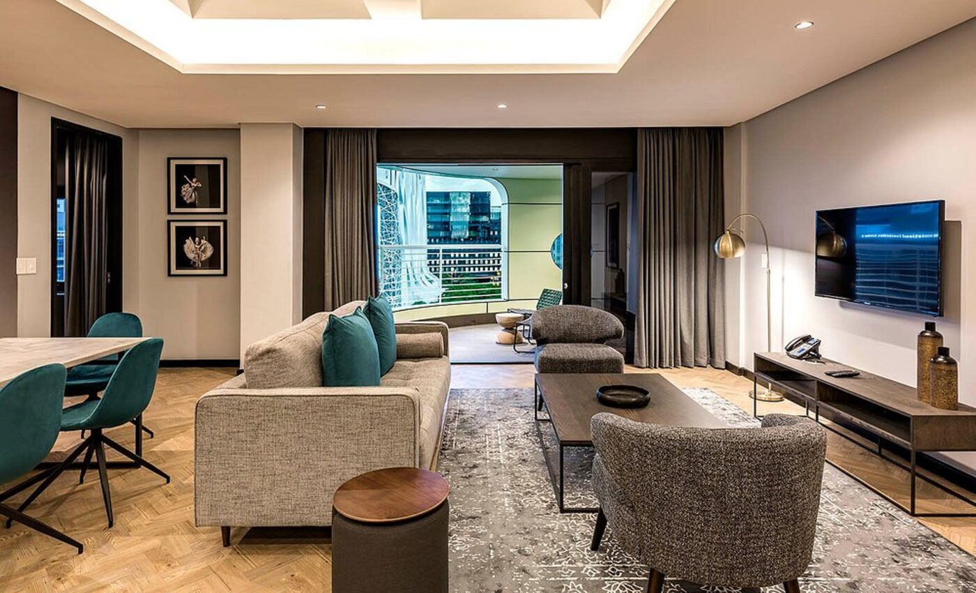 A suite lounge with a private balcony