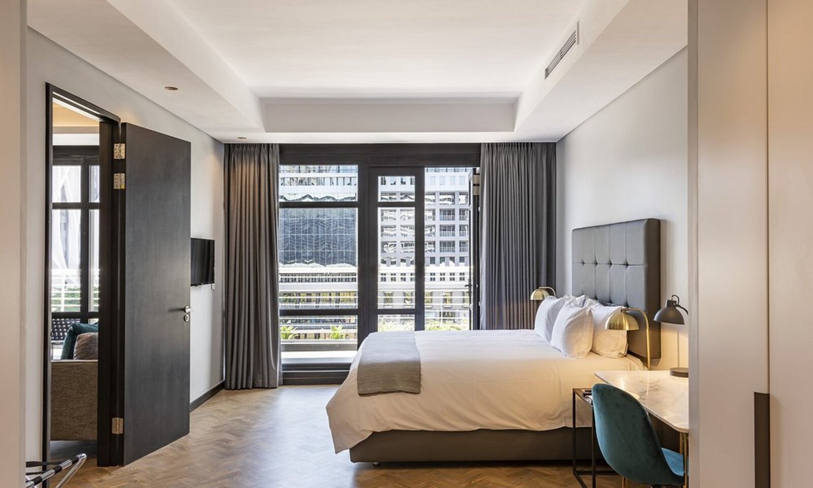 A sleek, modern room at The Onyx Hotel with a city view