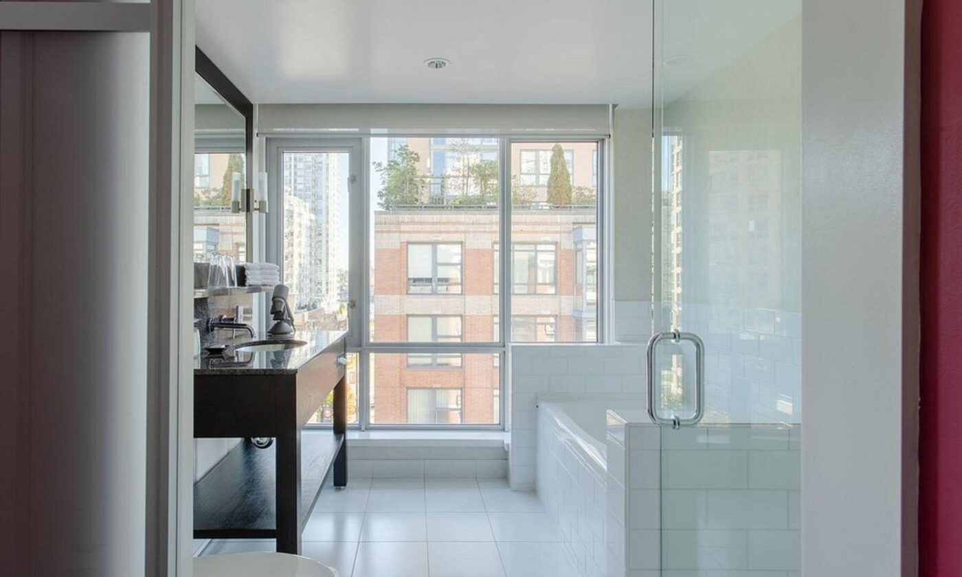 A bathroom with a walk-in shower