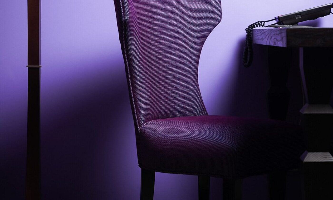 A sculptural violet chair, a signature design detail at OPUS Vancouver