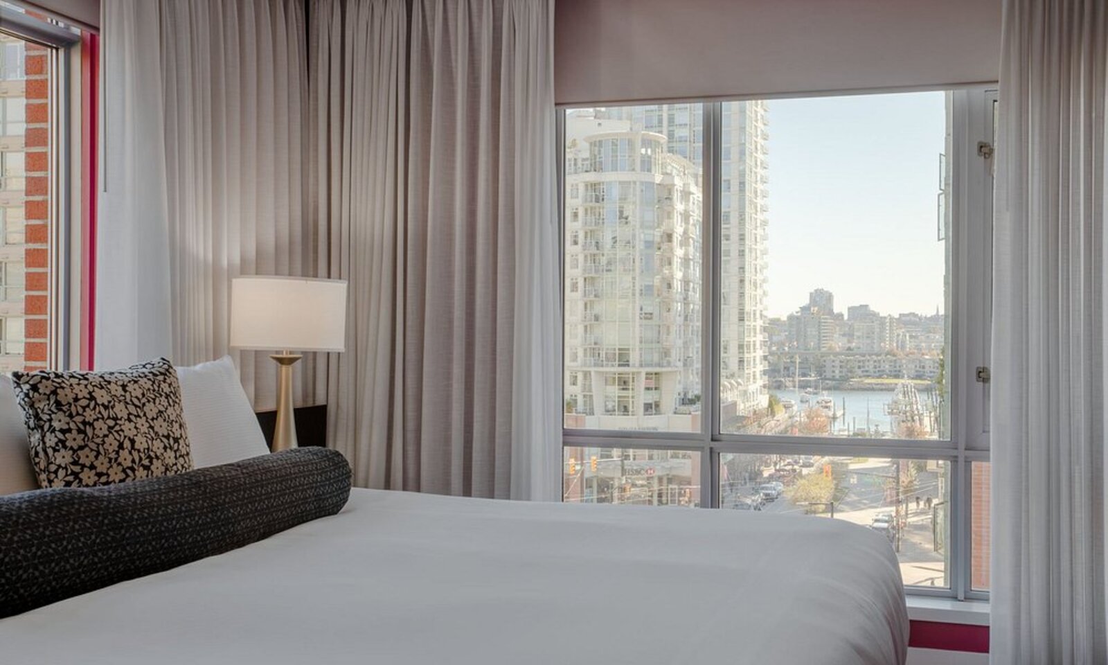 A room window at OPUS Vancouver looking out over the Yaletown and False Creek waterfront