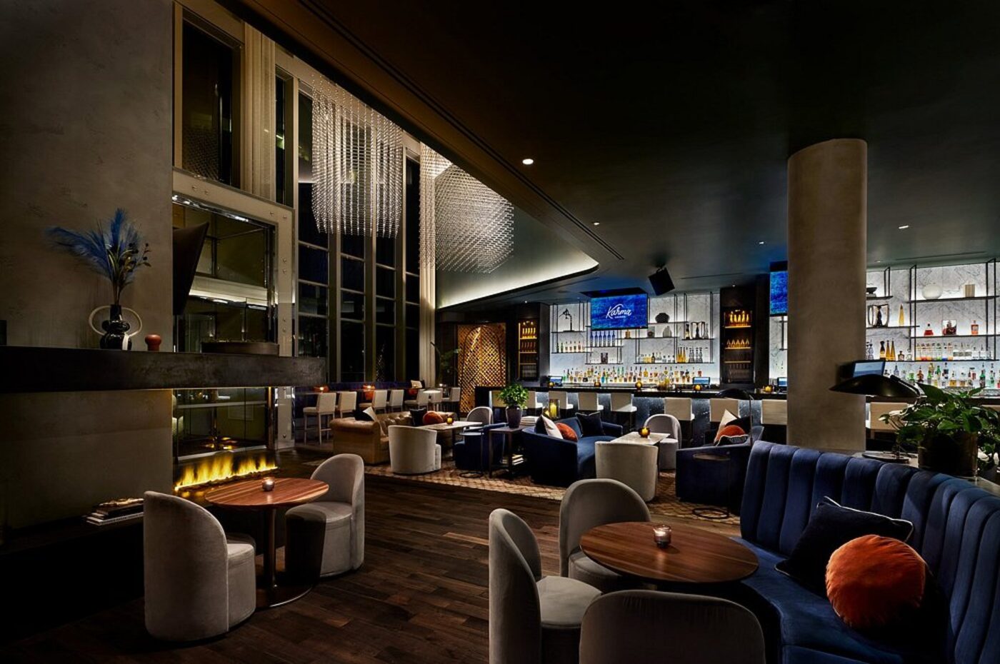 An evening bar and lounge with a fireplace