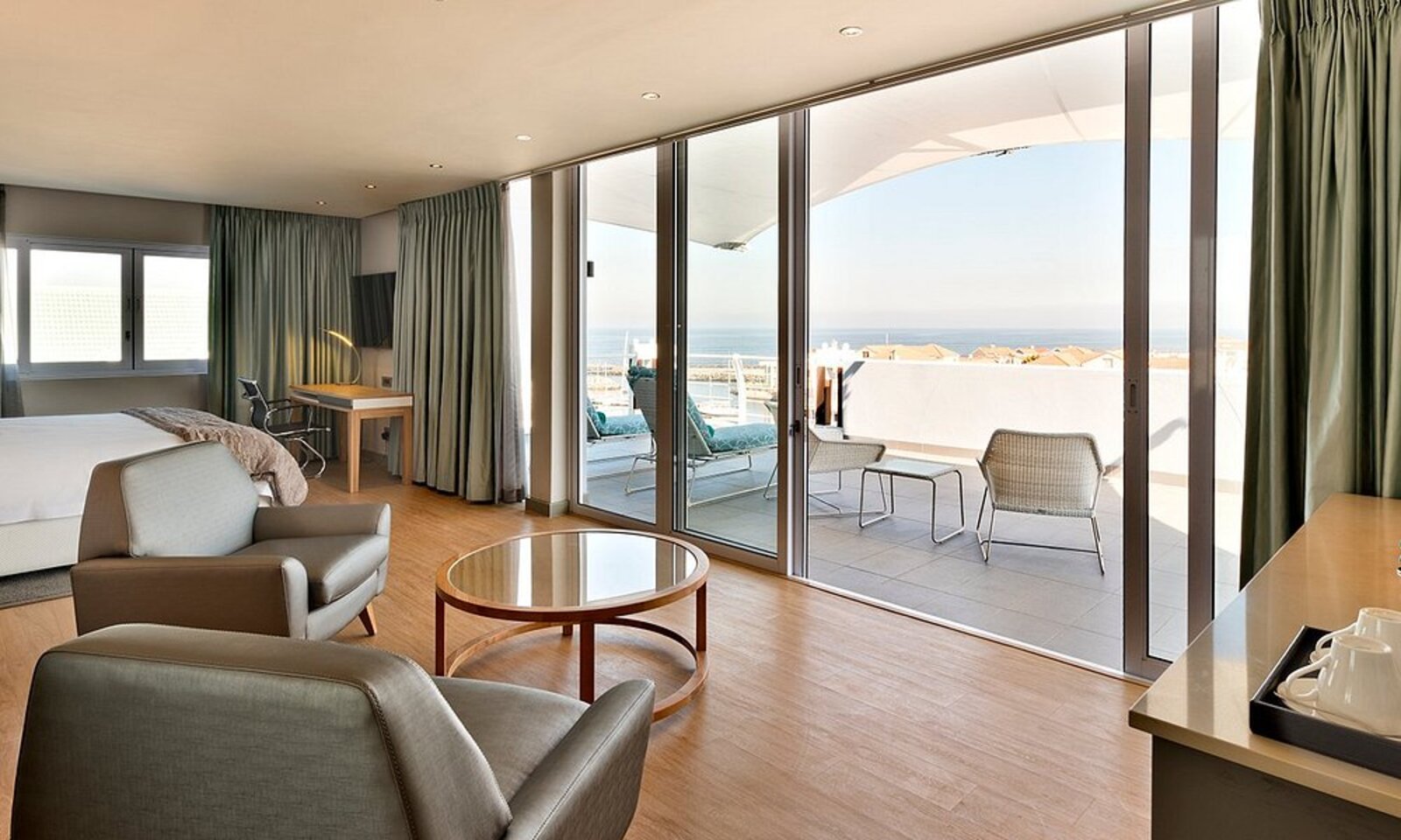 Guest room with balcony overlooking the marina at Krystal Beach Hotel