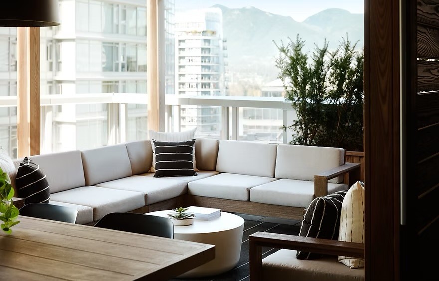 A terrace at the Loden Hotel, looking out toward the mountains across Coal Harbour