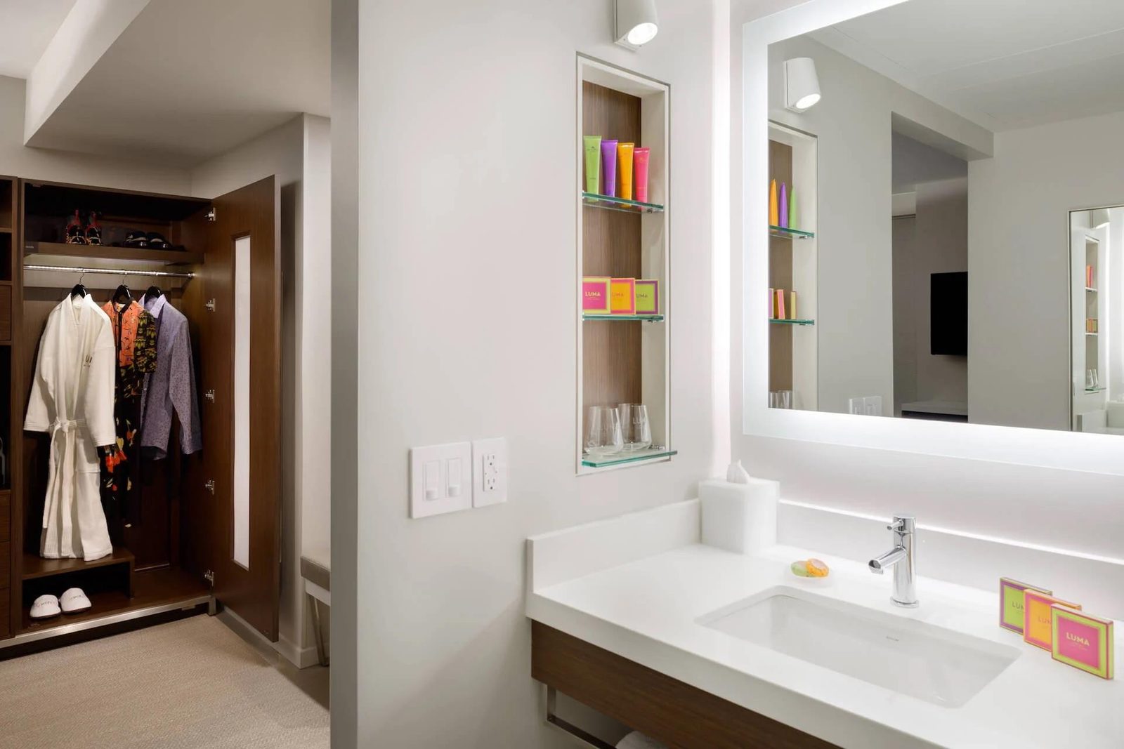 The vanity and dressing area with the hotel's own amenities