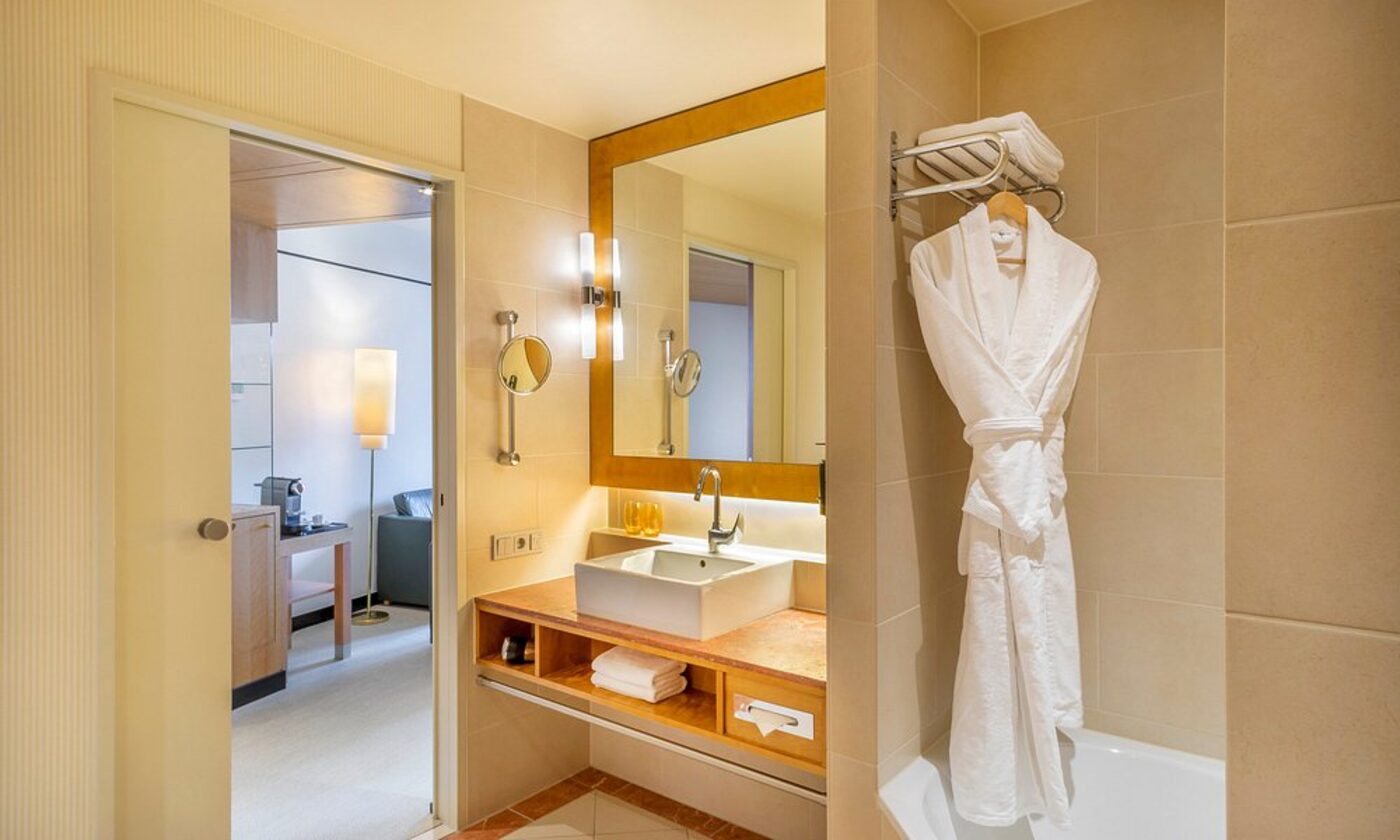 Bathroom with robe and marble vanity
