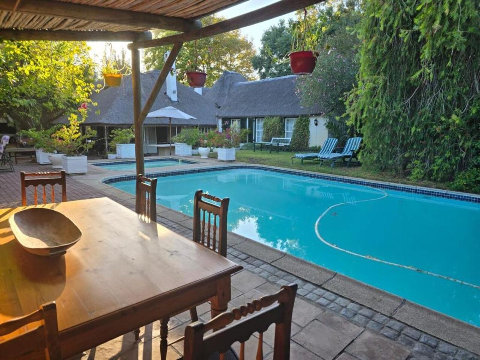 Pool and garden dining area at Meyerhof