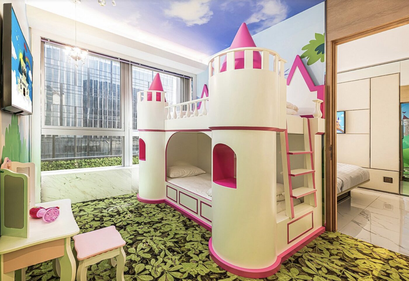 A pink castle-themed bunk room for children at Regala Skycity Hotel