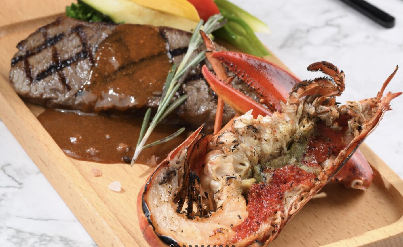 A grilled steak and lobster tail plated at one of the hotel's restaurants