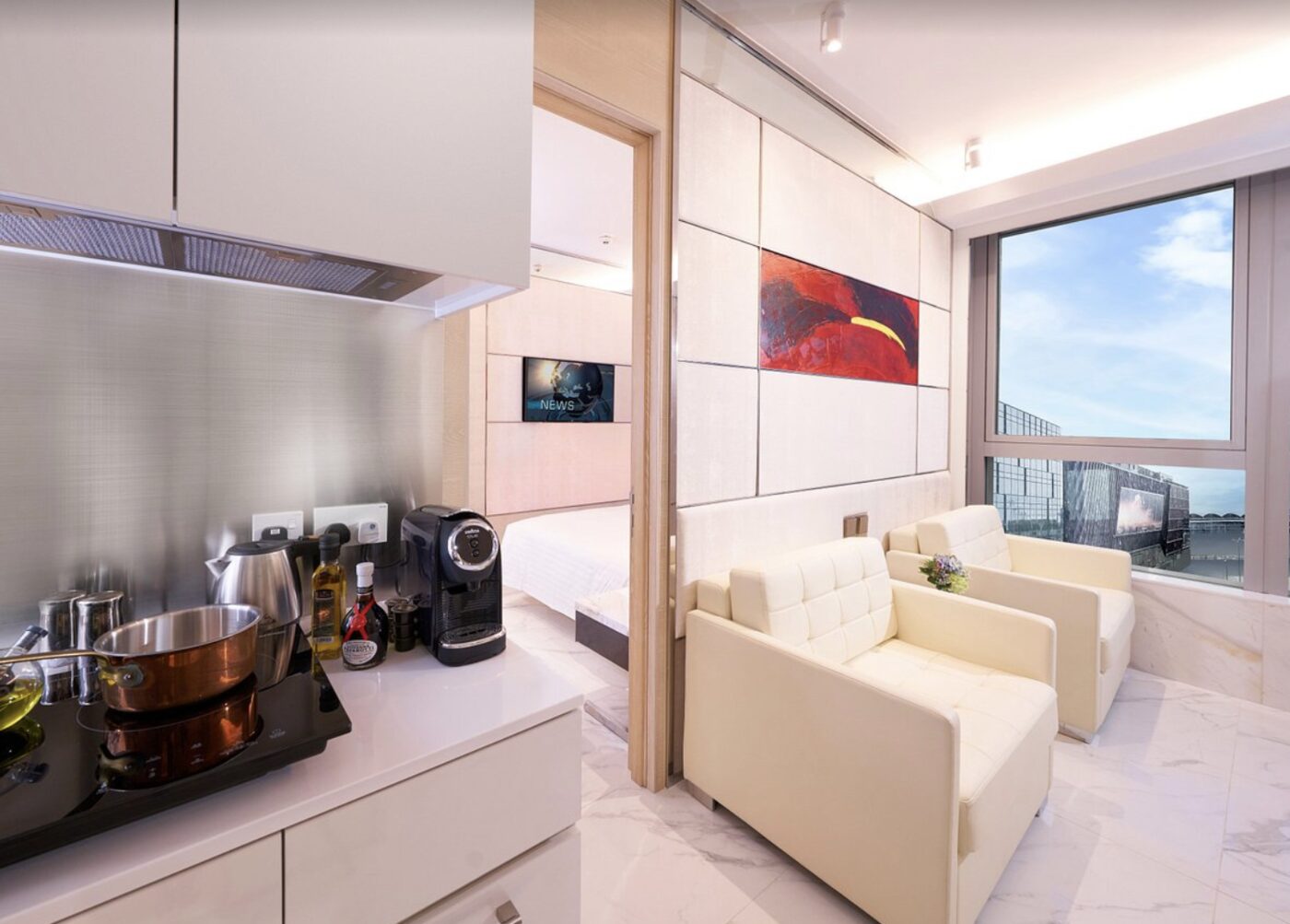 A serviced suite at Regala Skycity Hotel with a kitchenette and a view over the airport