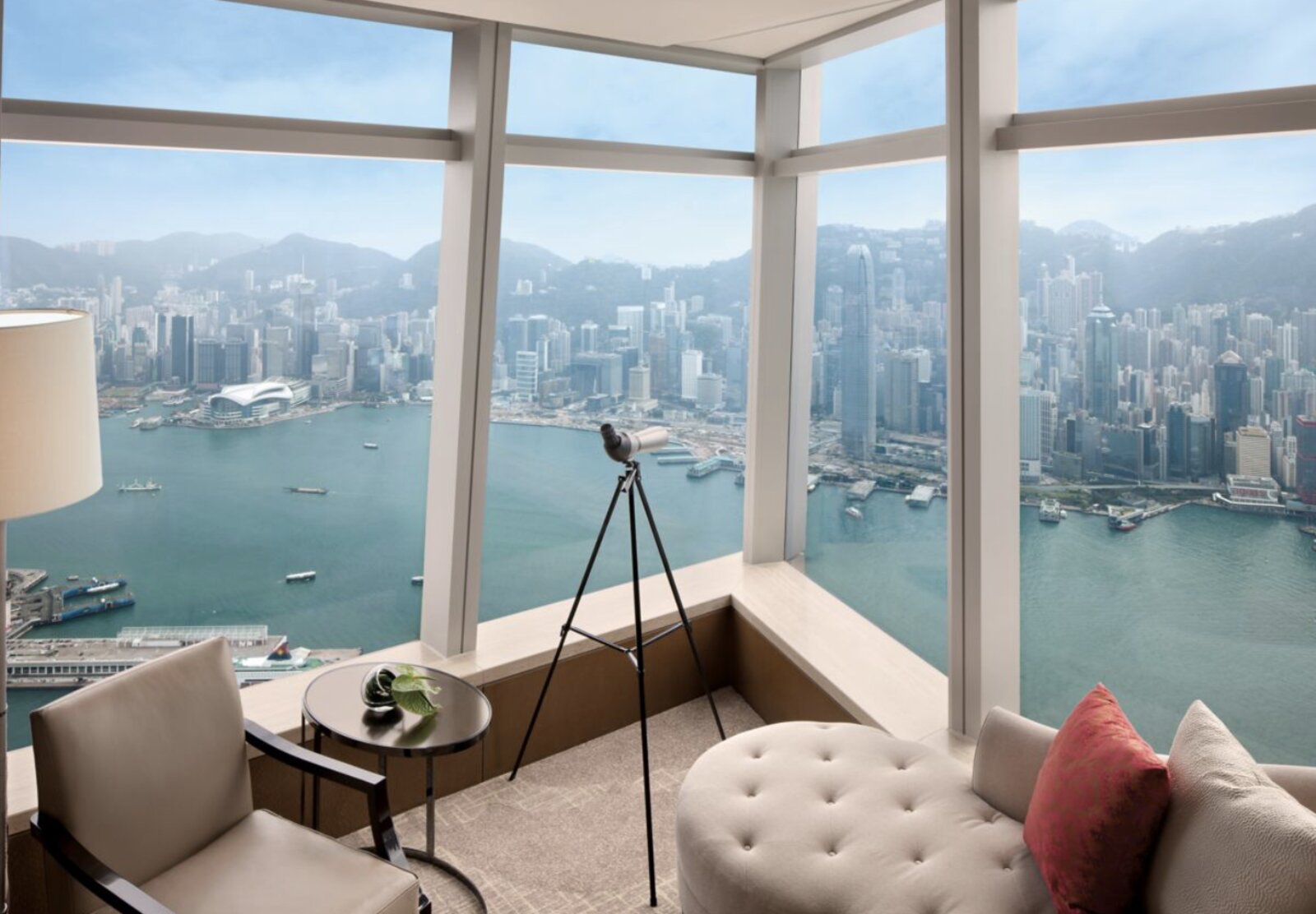 A club lounge corner at The Ritz-Carlton, Hong Kong with a telescope trained on Victoria Harbour