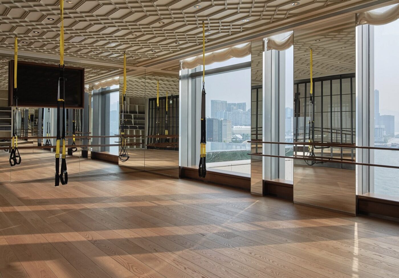 A barre and fitness studio at Rosewood Hong Kong with harbour views