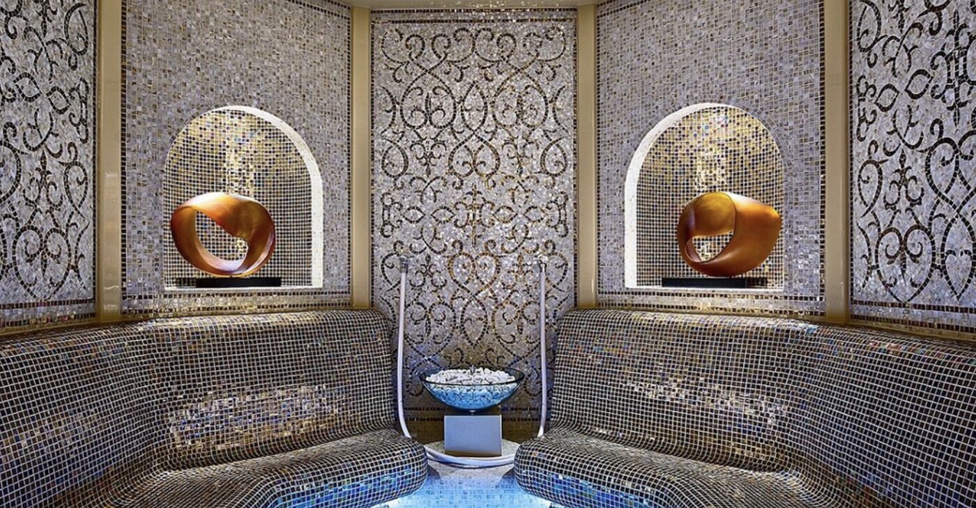 A mosaic-tiled relaxation room in the spa at The Royal Garden